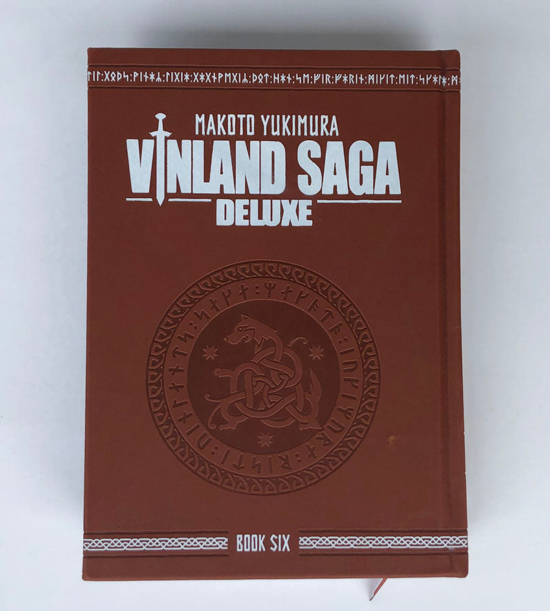 Vinland Saga Deluxe Book Six, red brown faux-leather hardcover with embossed Viking rune medallion